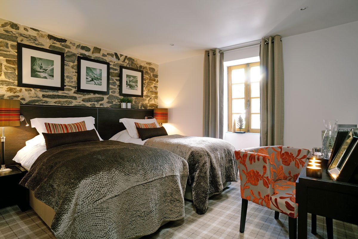 Chalet_Abode_bedroom-2 Chalet Abode bedroom with orange cushions and chair